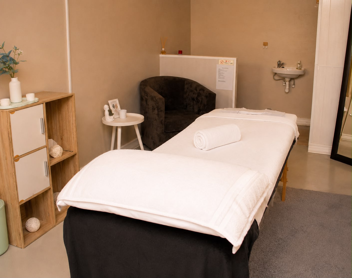 Candlelit massage room at Aphrodite Studios in Durbanville